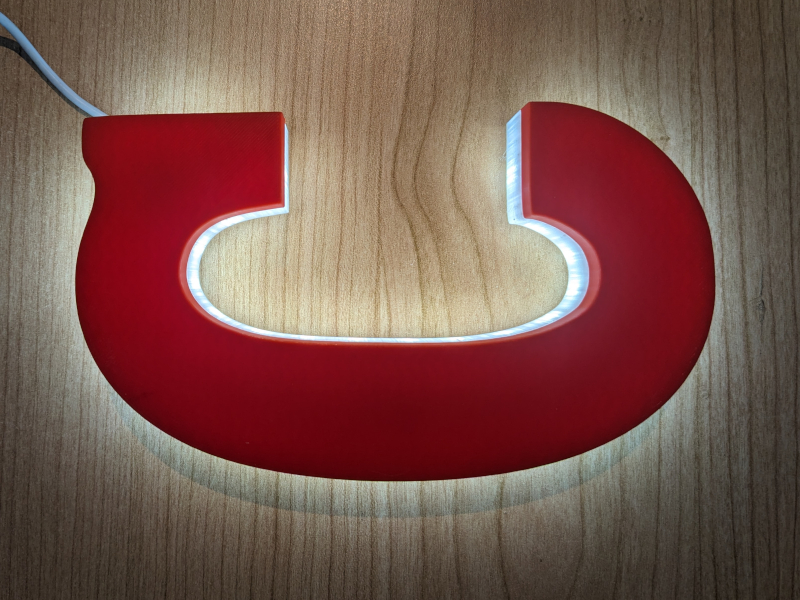 Illuminazione insegna Campari